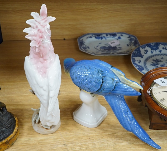 A Royal Dux porcelain model of a parrot and cockatoo, tallest 38cm. Condition - fair